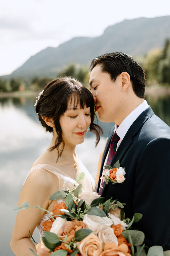 Bride and Groom with Broadmoor Lake in the background