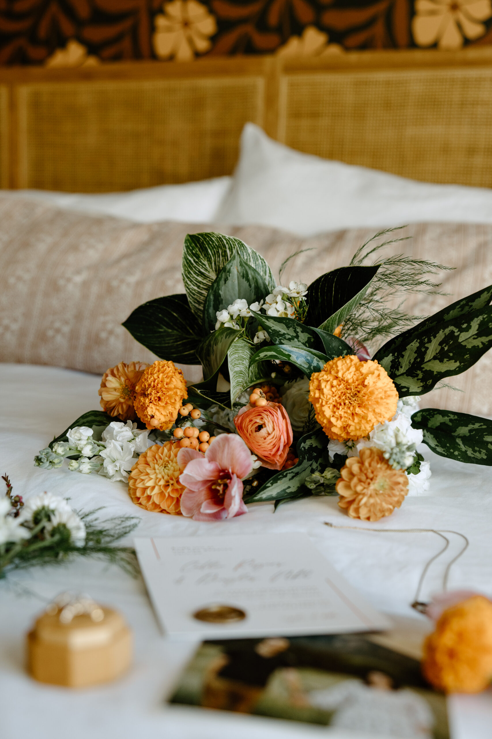 Wedding details arranged on a hotel bed